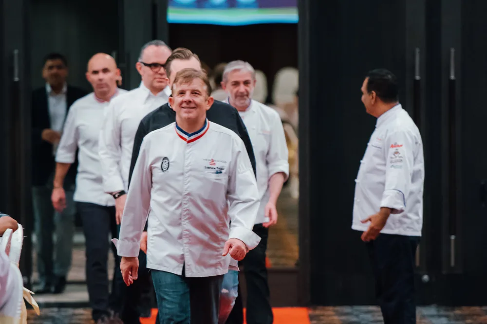 Visiting master chefs walking into an APCA event