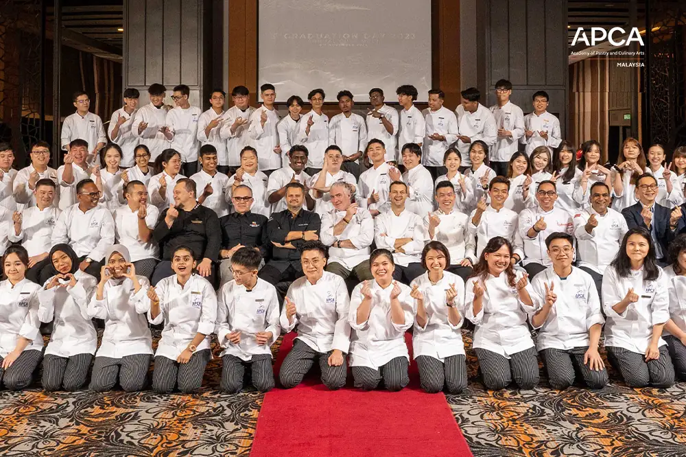 APCA students and chefs gathered for a group photograph